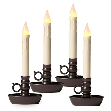 Set it and forget it till you have to change the batteries. . Battery operated window candles